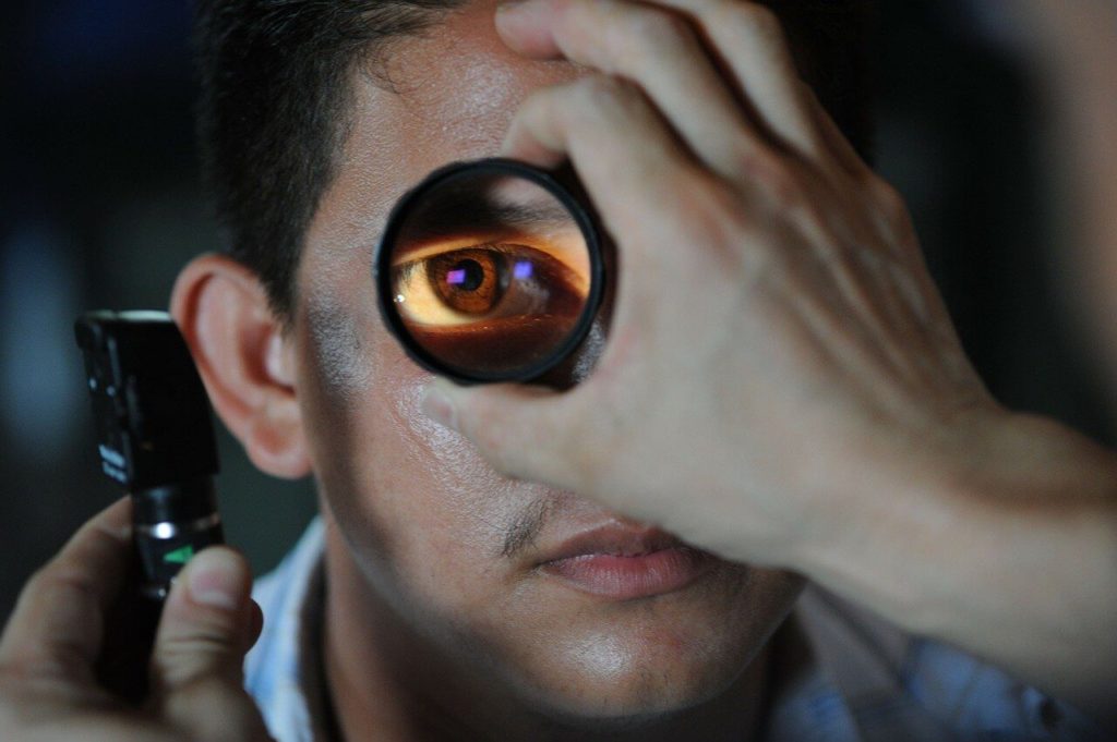  a man having his eye checked