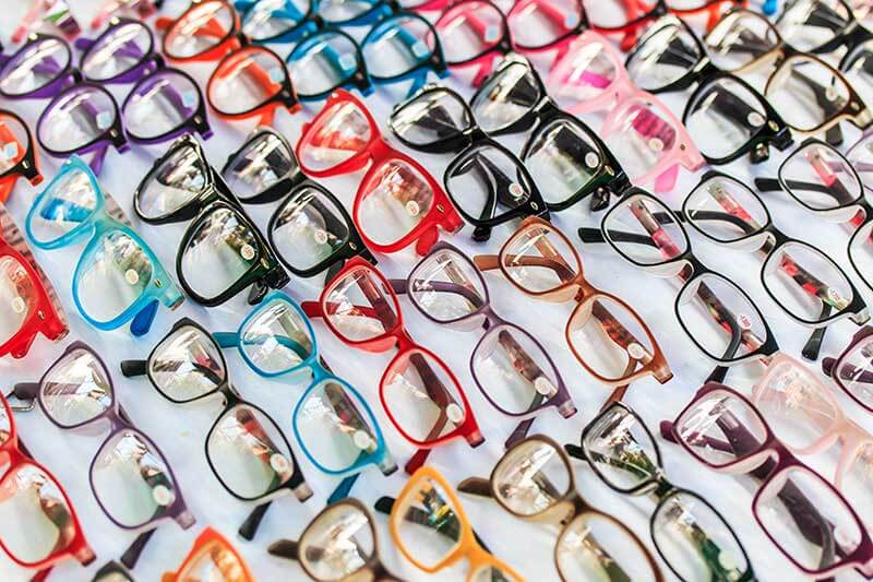 a large selection of colorful eyeglass frames