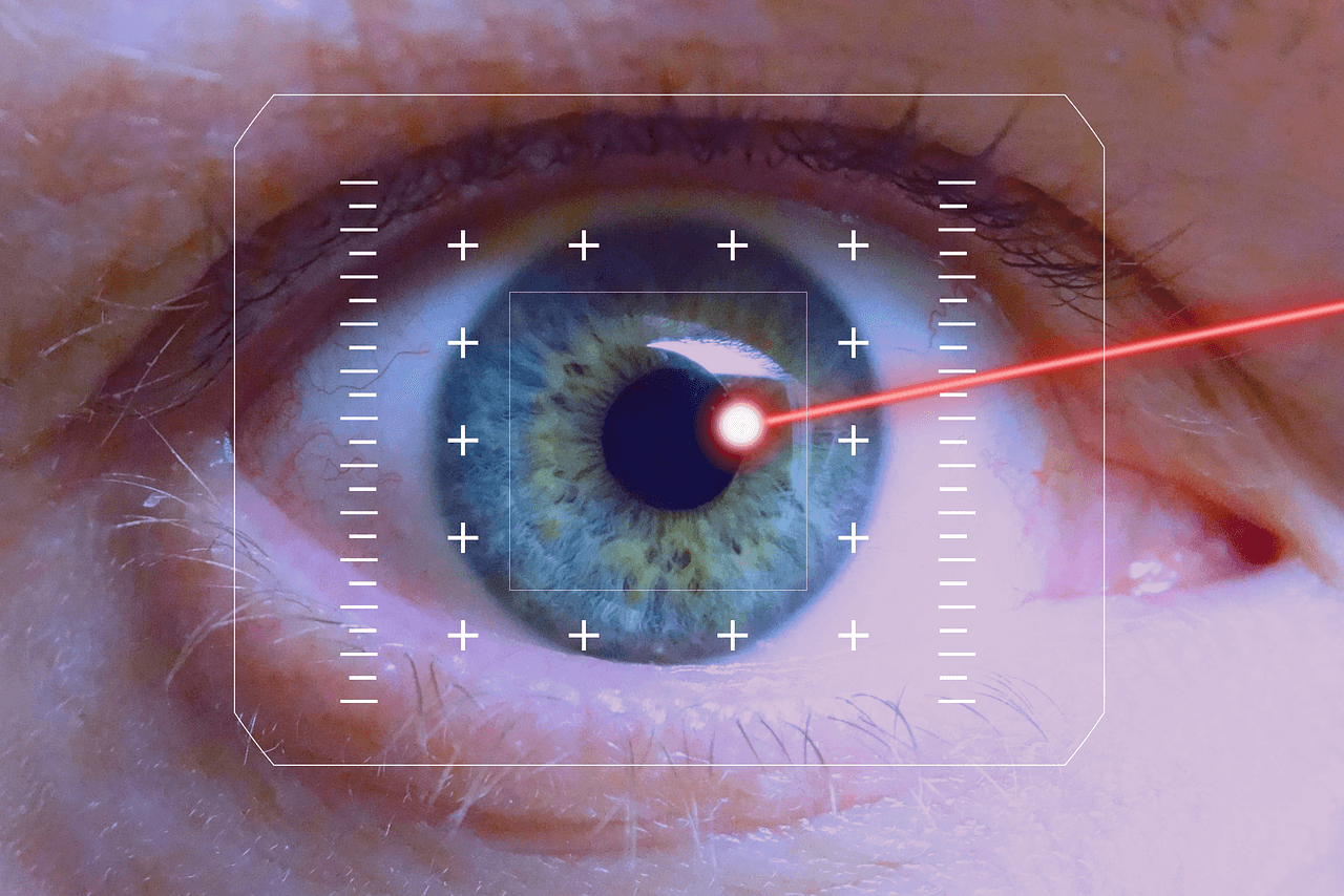 a laser pointing into a man's eye